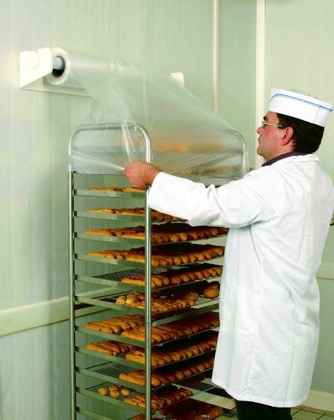 DISPOSITIVO PORTA ROTOLO PER COPERTURA CARRELLI